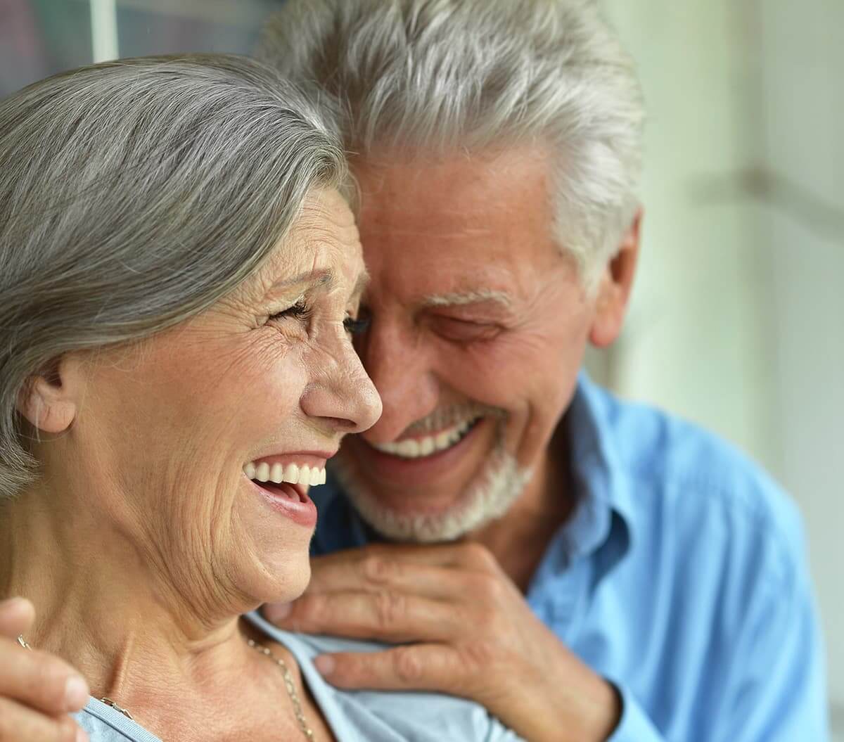 senior couple laughing together