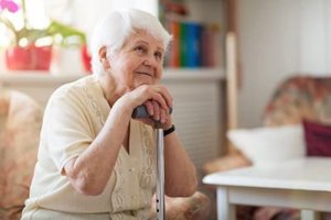 a woman is happy to be in a memory care nursing home in MD